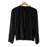 Black pussy bow tie shirt on a hanger loosely tied at the front neck. This is in Lyocell so is less sheer.